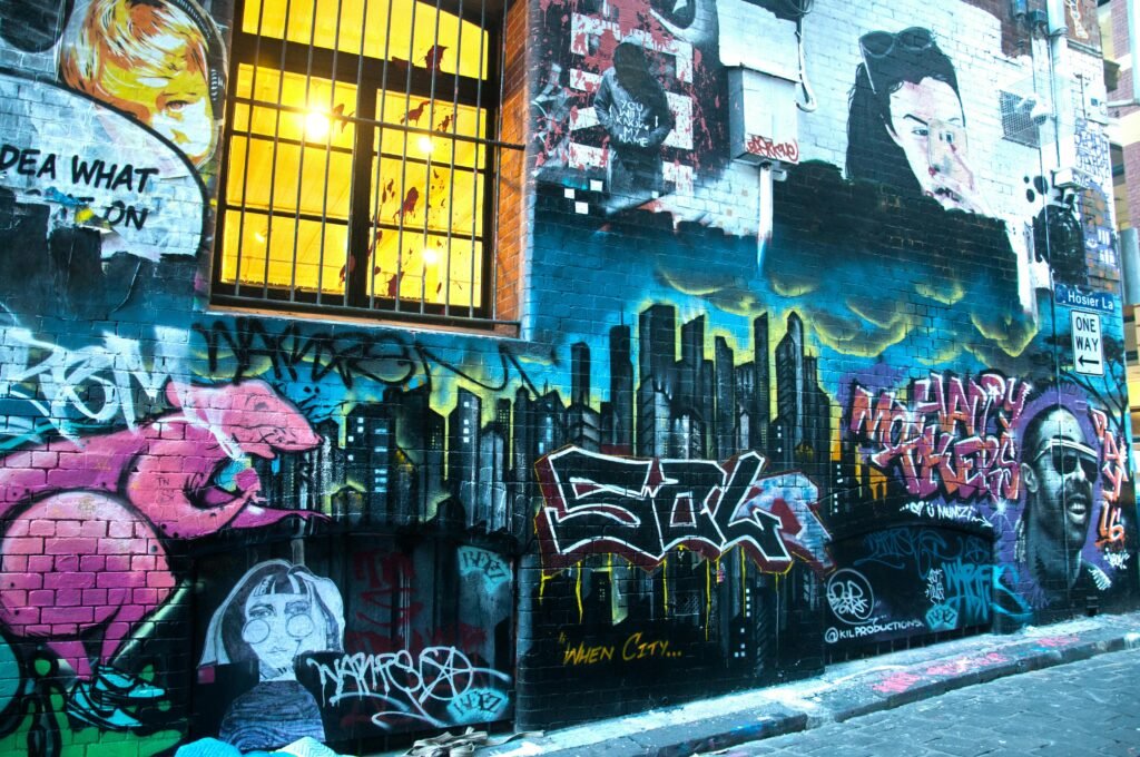 Vivid graffiti art on an urban brick wall in a city alleyway.